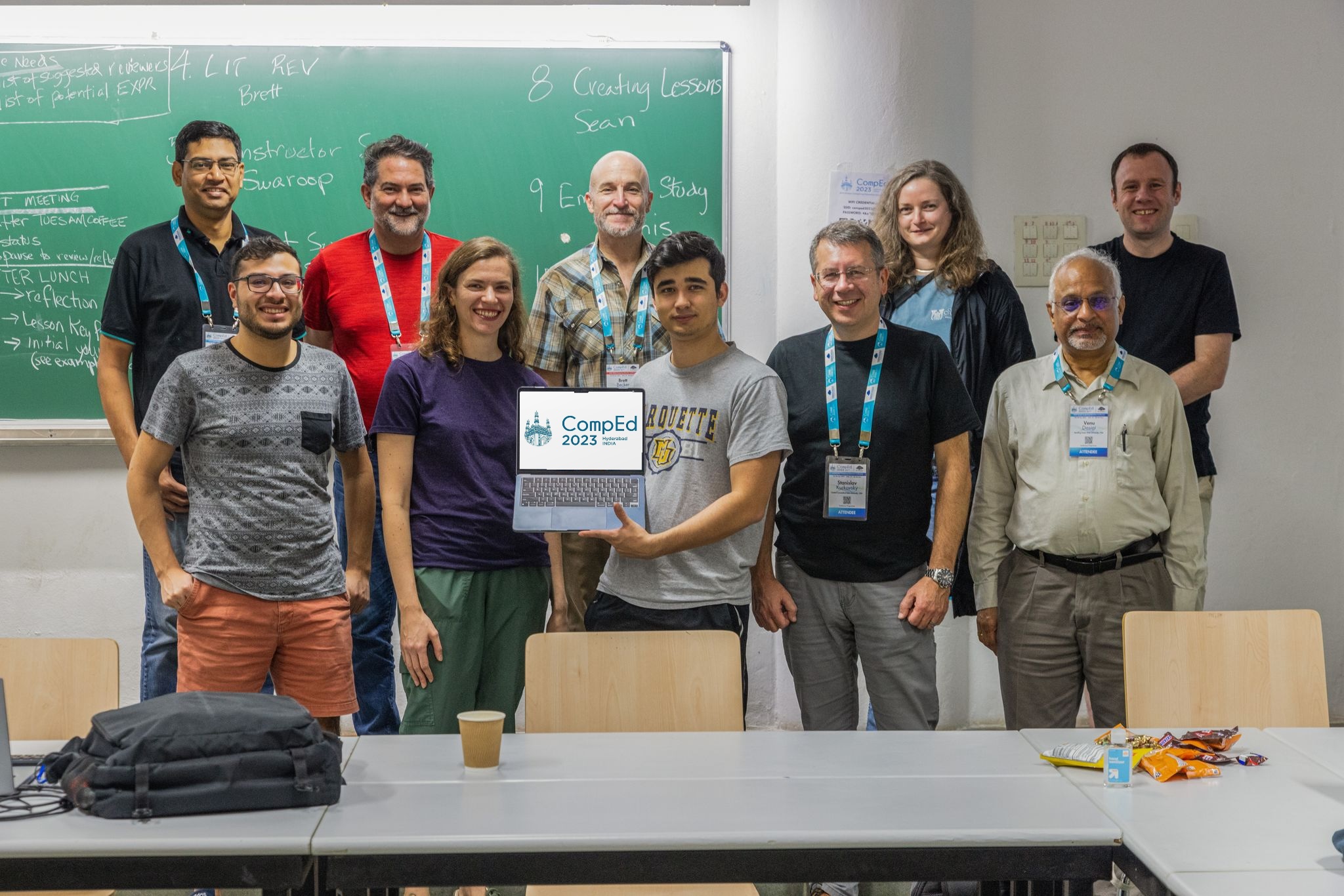 A group picture of the members of CompEd WG1, during the working group sprint in Hyderabad, India. Top-row (left-to-right): Swaroop Joshi, Dennis J Bouvier, Brett A. Becker, Ellie Lovellette, Seán Russell; bottom row, (left-to-right): Eddie Antonio Santos, Olga Glebova, Jack Forden, Stan Kurkovsky, Venu Dasigi.